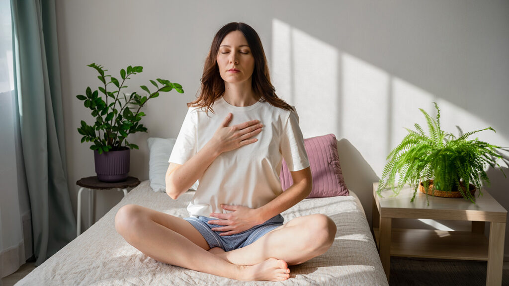 woman using diaphragmatic breathing